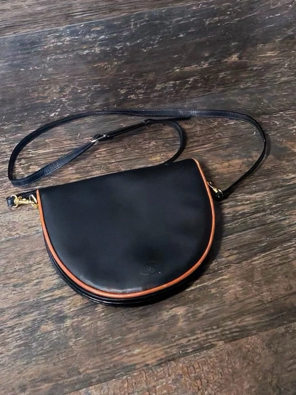 Leather Crescent Crossbody Bag in Black with Brown Trim